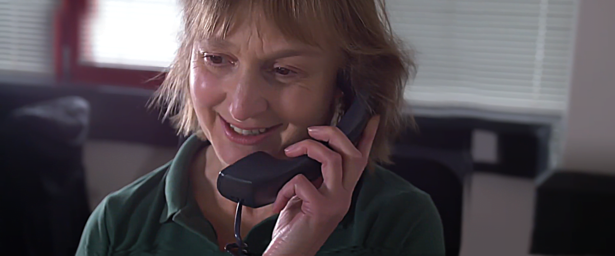 Photograph of a member of Trackplot's Customer Support on the phone to a customer.