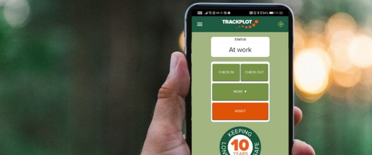 Photograph of Trackplot Mobile App being used on a smartphone by a lone worker.