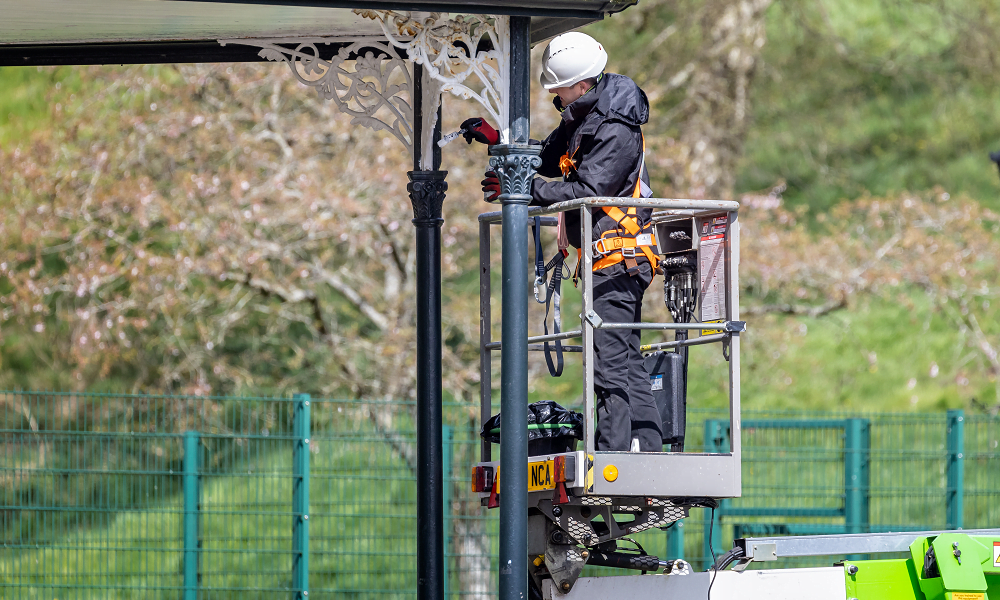 Image of lone working park maintenance worker.